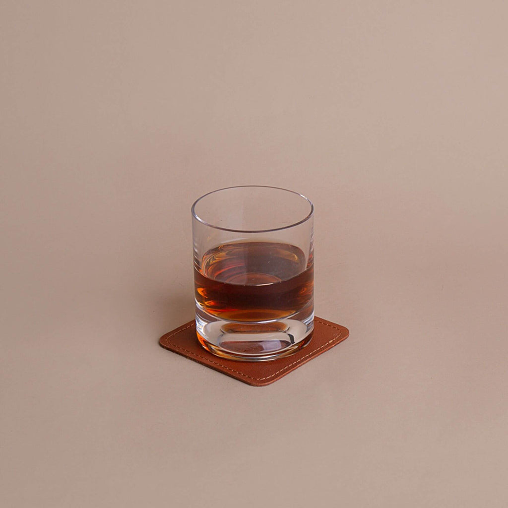 cognac leather coaster with glass