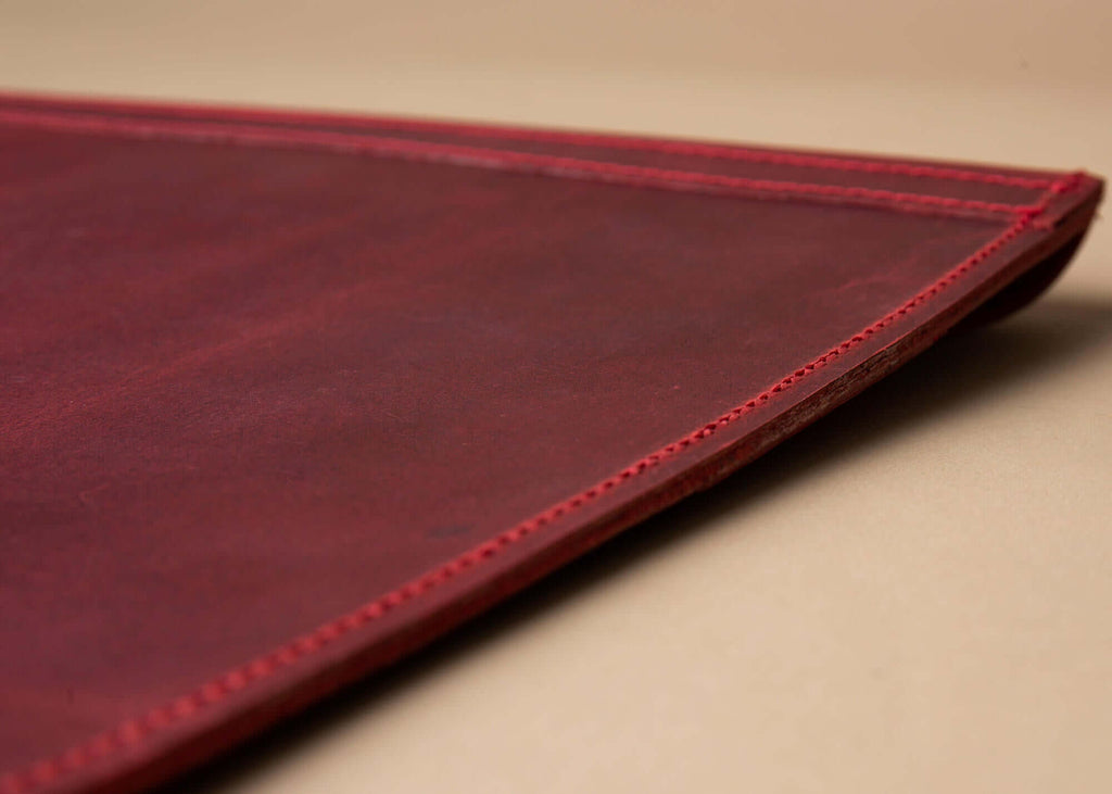 red leather macbook pro case corner